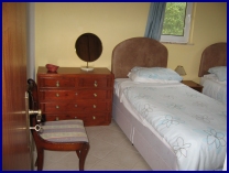 slightly smaller twin bedroom