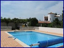 Pool with villa in background